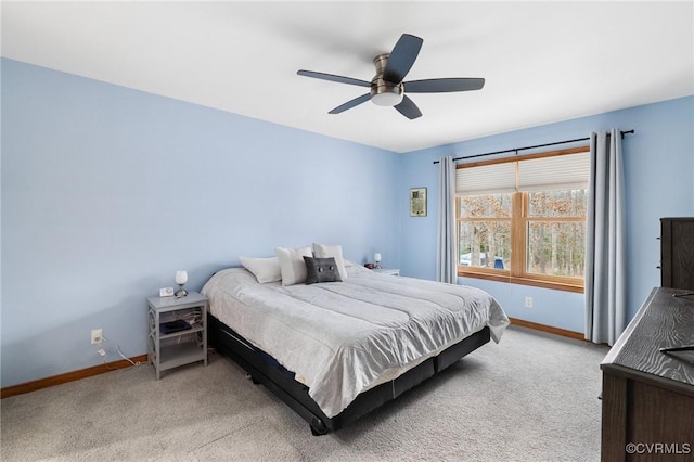 bedroom featuring light colored carpet and ceiling fan