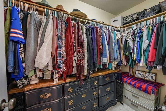 walk in closet featuring carpet