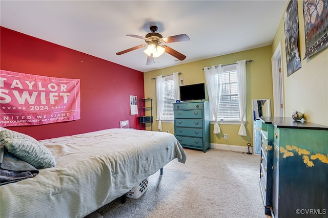 bedroom with light colored carpet and ceiling fan