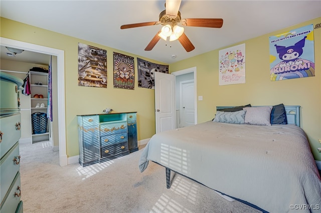 bedroom featuring light colored carpet and ceiling fan