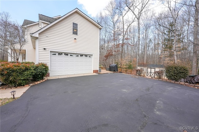 view of side of home with a garage