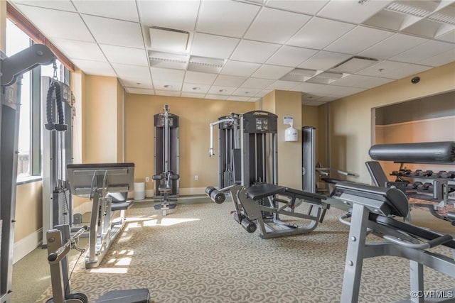 exercise room featuring a paneled ceiling