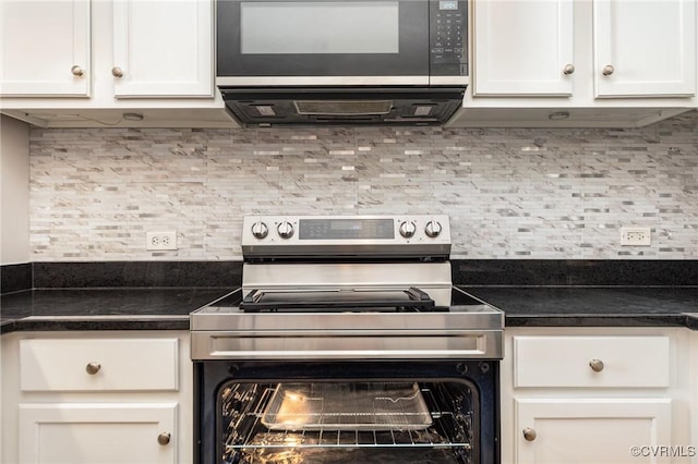 kitchen with electric stove, tasteful backsplash, and white cabinets