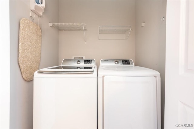 washroom featuring washing machine and dryer