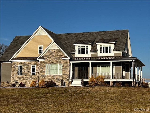 view of front of house with a standing seam roof, covered porch, and metal roof