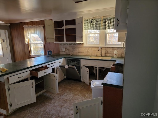 kitchen with light tile patterned floors, sink, white cabinetry, and tasteful backsplash