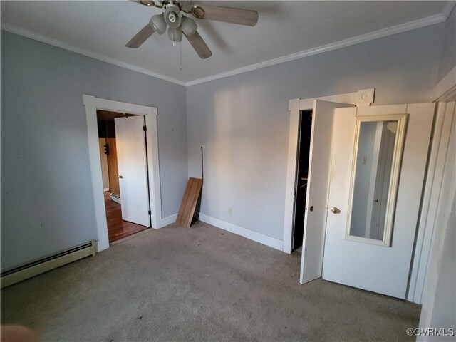 empty room with crown molding, a baseboard heating unit, light colored carpet, and ceiling fan