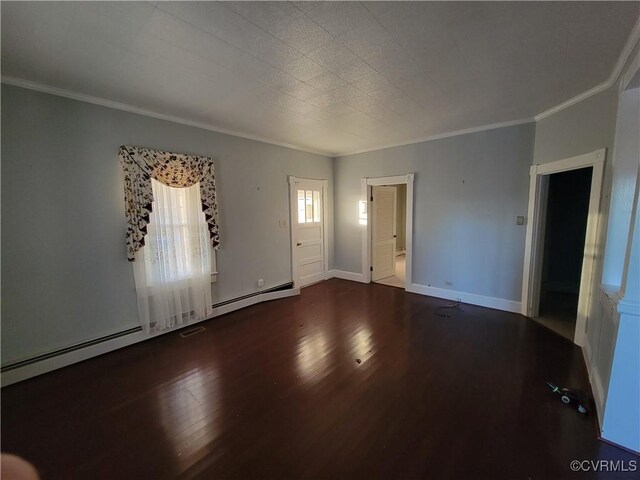 empty room featuring a baseboard heating unit, crown molding, and dark hardwood / wood-style floors