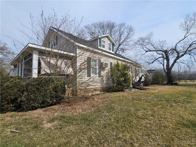 view of home's exterior featuring crawl space and a yard