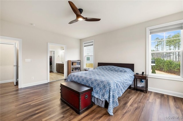 bedroom featuring dark wood-type flooring, ceiling fan, and ensuite bathroom