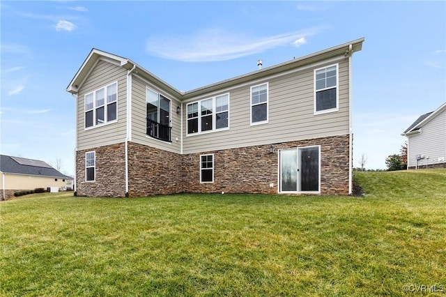 rear view of house with a yard