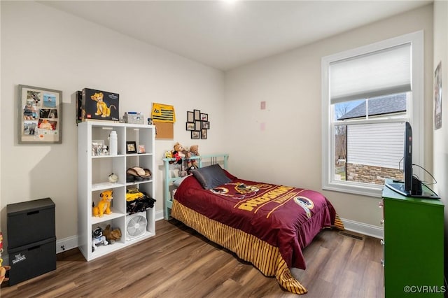 bedroom featuring dark wood-type flooring