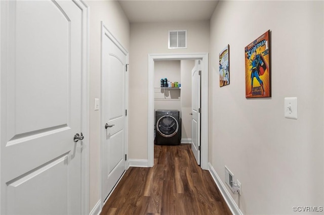 hallway with washer / clothes dryer and dark hardwood / wood-style floors