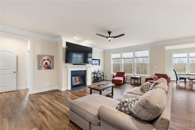 living room featuring crown molding, ceiling fan, and hardwood / wood-style flooring