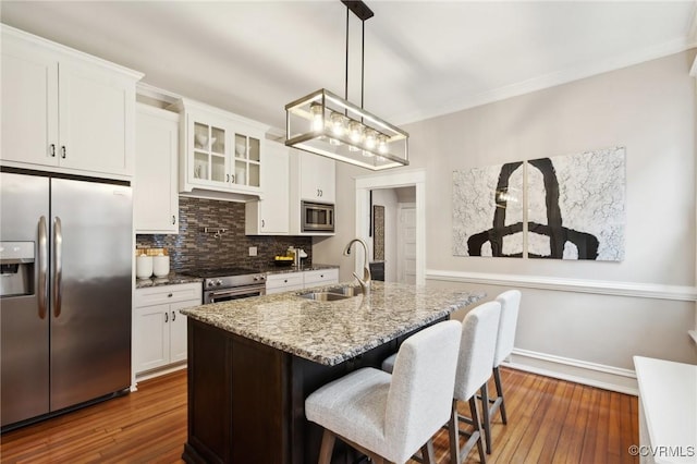 kitchen featuring sink, stainless steel appliances, and white cabinets