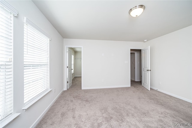 empty room featuring light colored carpet