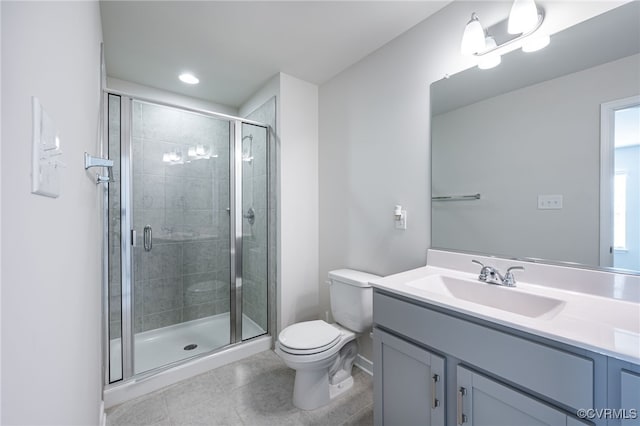 bathroom featuring vanity, an enclosed shower, tile patterned floors, and toilet