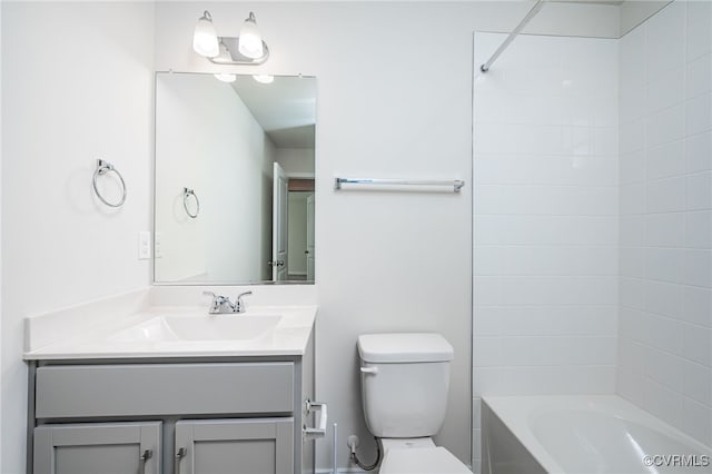 full bathroom with vanity, toilet, and tiled shower / bath