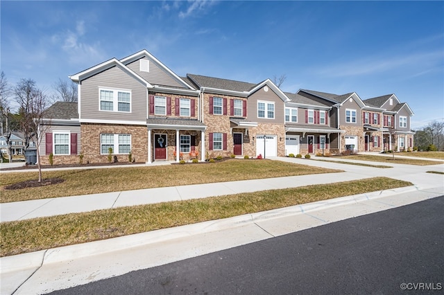 townhome / multi-family property featuring a front yard