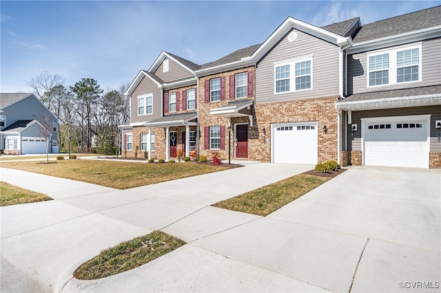 multi unit property featuring a garage and a front yard