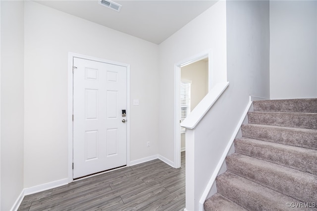 foyer with wood-type flooring