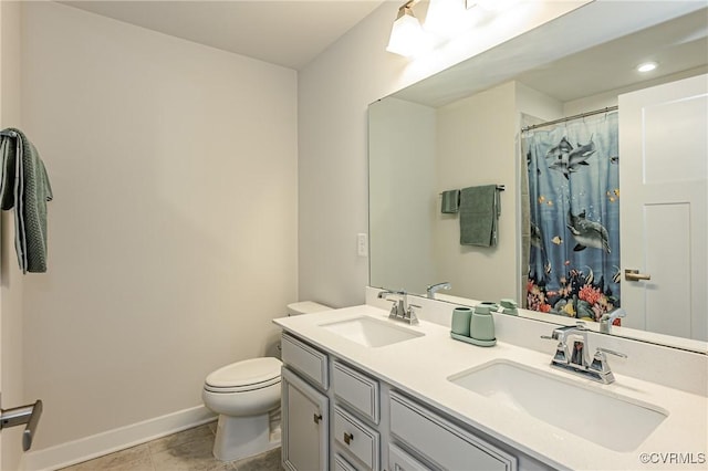 bathroom with vanity, toilet, and walk in shower