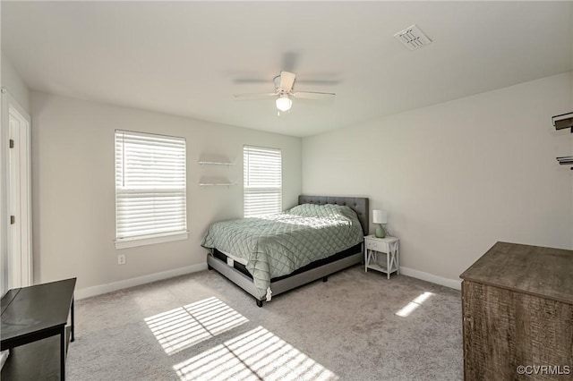 bedroom featuring ceiling fan and light carpet