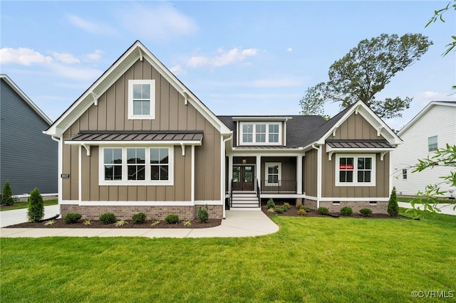 view of front of property with a porch and a front yard