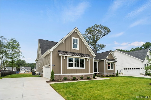 view of front of home with a garage, a front yard, and central AC unit