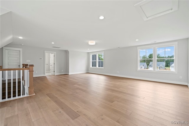 spare room with light hardwood / wood-style floors