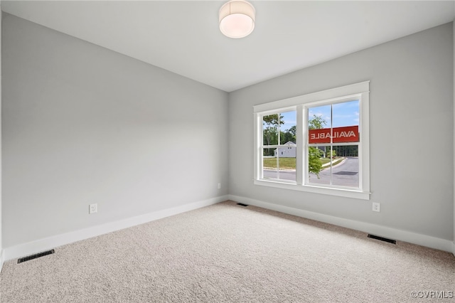 empty room featuring carpet flooring