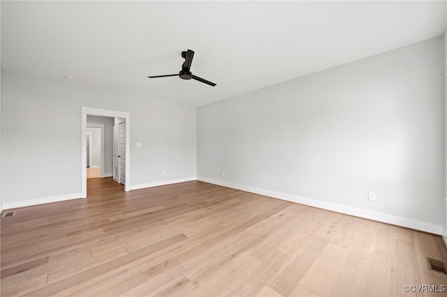 empty room featuring ceiling fan and light wood-type flooring