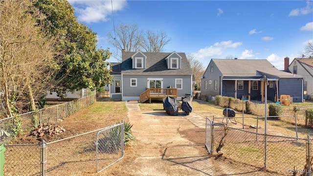 back of house with a wooden deck