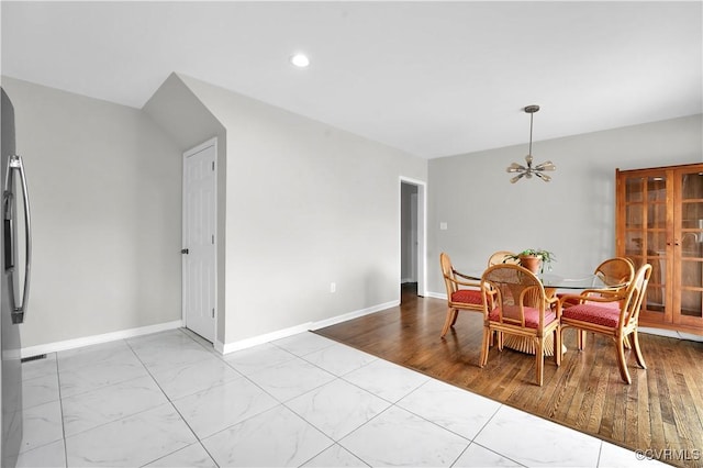 dining space featuring an inviting chandelier