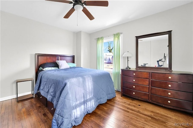 bedroom featuring dark wood-type flooring and ceiling fan