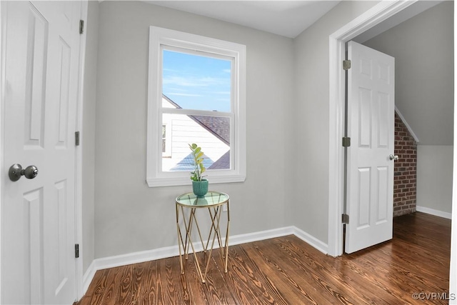 additional living space featuring dark hardwood / wood-style flooring