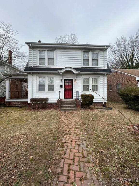 front facade with a front yard