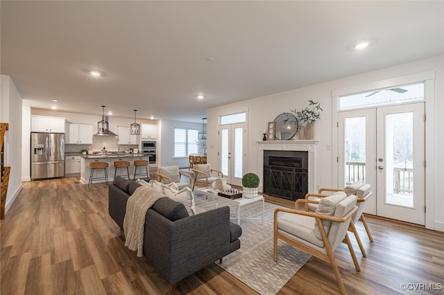 living room featuring hardwood / wood-style flooring and french doors