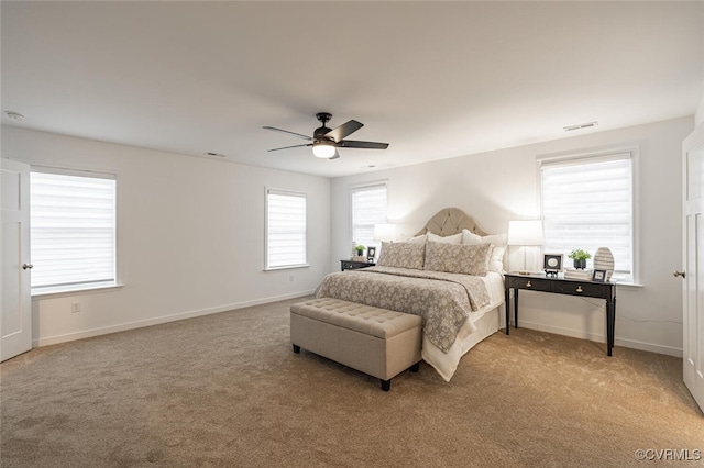 carpeted bedroom with ceiling fan