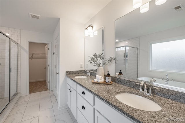 bathroom with vanity and walk in shower