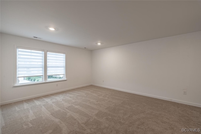 empty room featuring light colored carpet