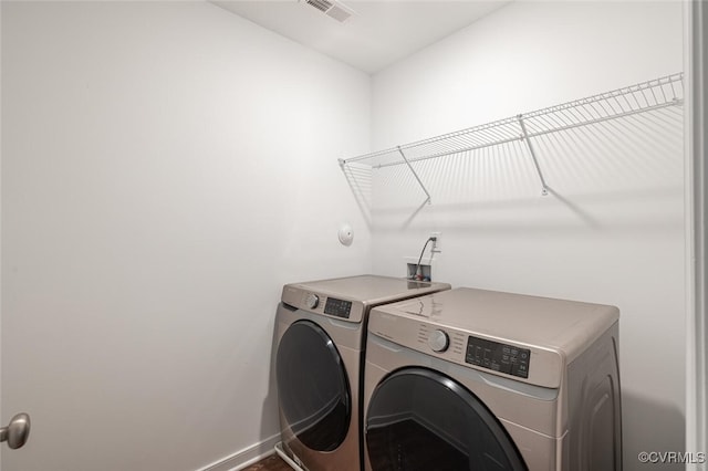 laundry room with washer and dryer