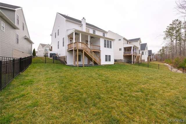 back of property featuring a yard and a deck