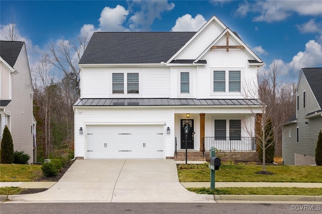 view of front facade featuring a garage, covered porch, and a front lawn