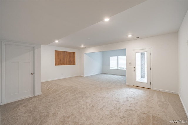 unfurnished room with light carpet