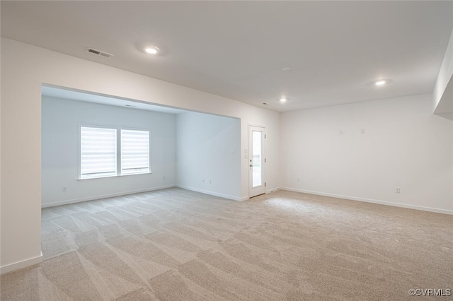 spare room with light carpet