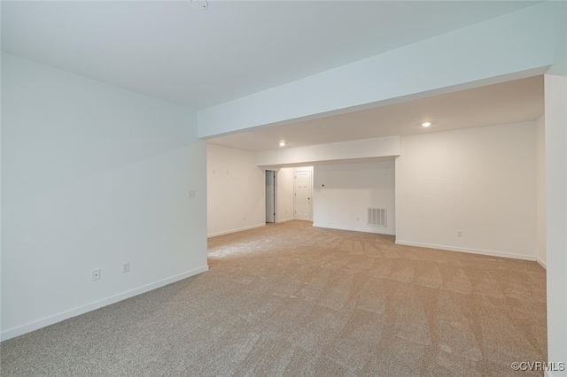 unfurnished room with light carpet