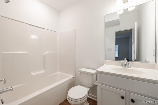 full bathroom featuring vanity, wood-type flooring, shower / bathing tub combination, and toilet