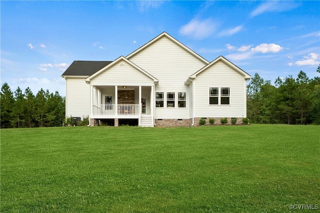 rear view of property with a porch and a yard