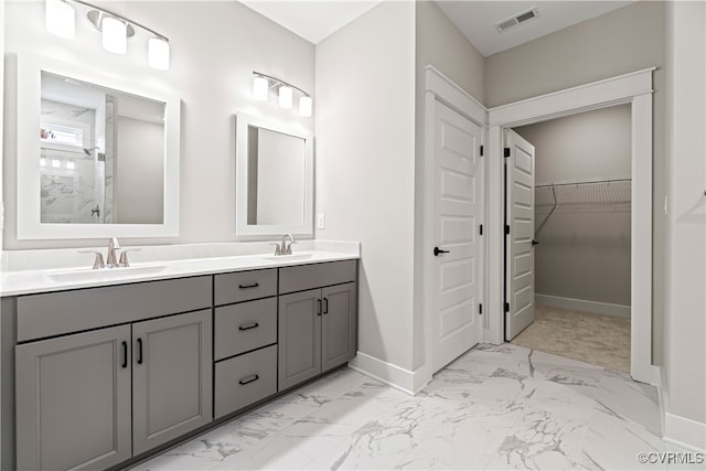 bathroom featuring vanity and a shower